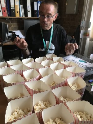 Production Manager Phil Clark surveying the popcorn used in Solar Youth Theatre's Rock Around the Clock